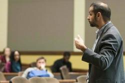 Image of a sociology faculty member speaking to a lecture hall.